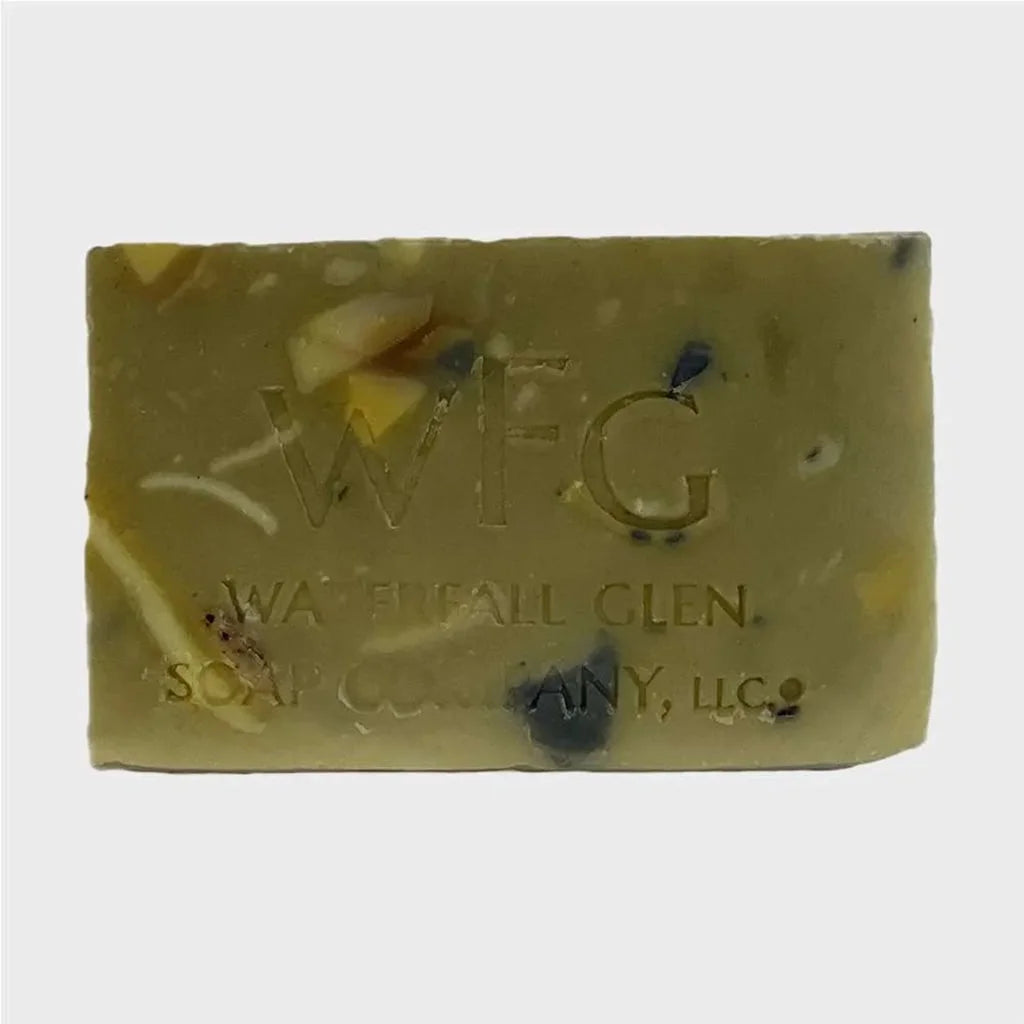 yellow and green mixed bar soap with specs of dark green spotting