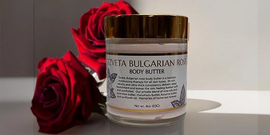 tzveta body butter glass container with a red rose in the background on top of a countertop