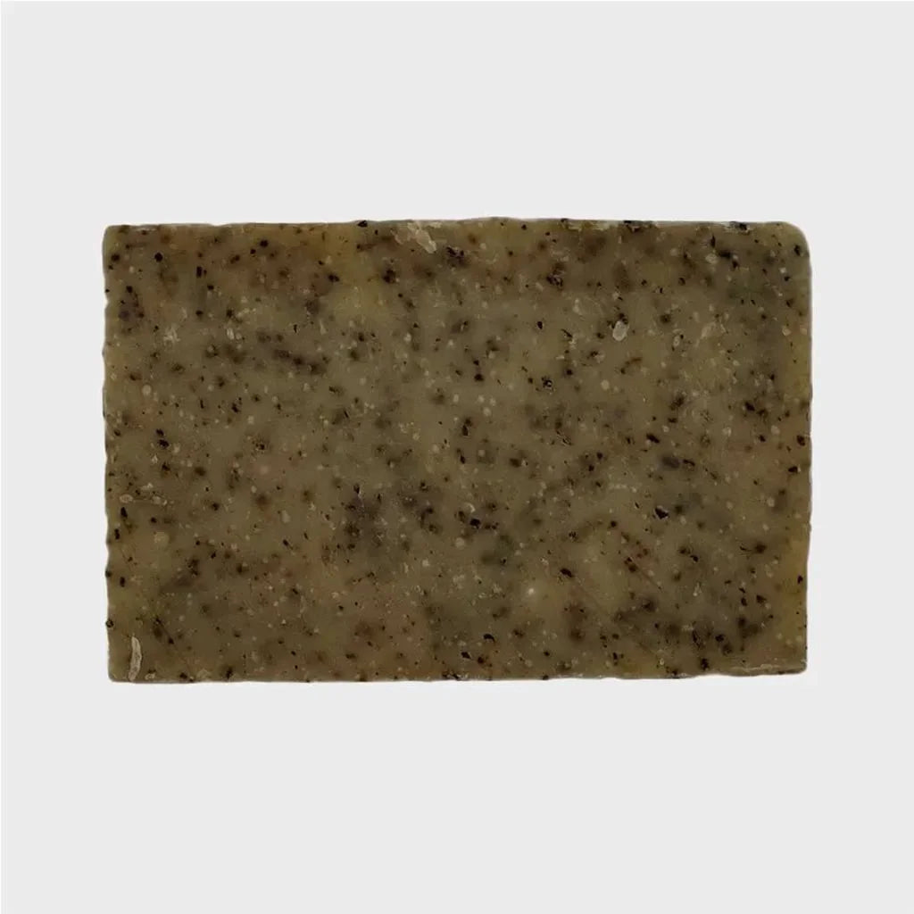 light brown bar soap with multiple dark brown spotting