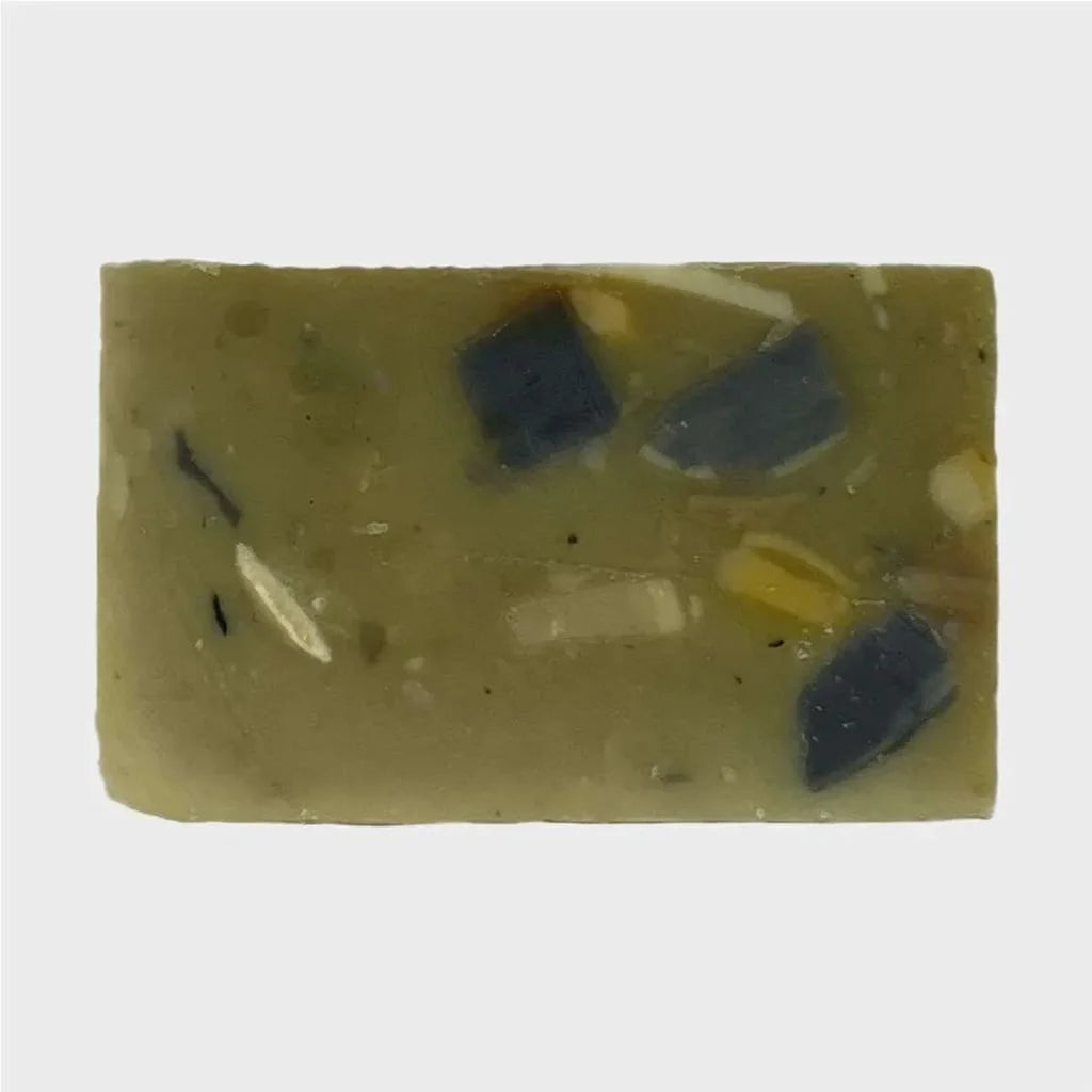 yellow and green mixed bar soap with specs of dark green spotting