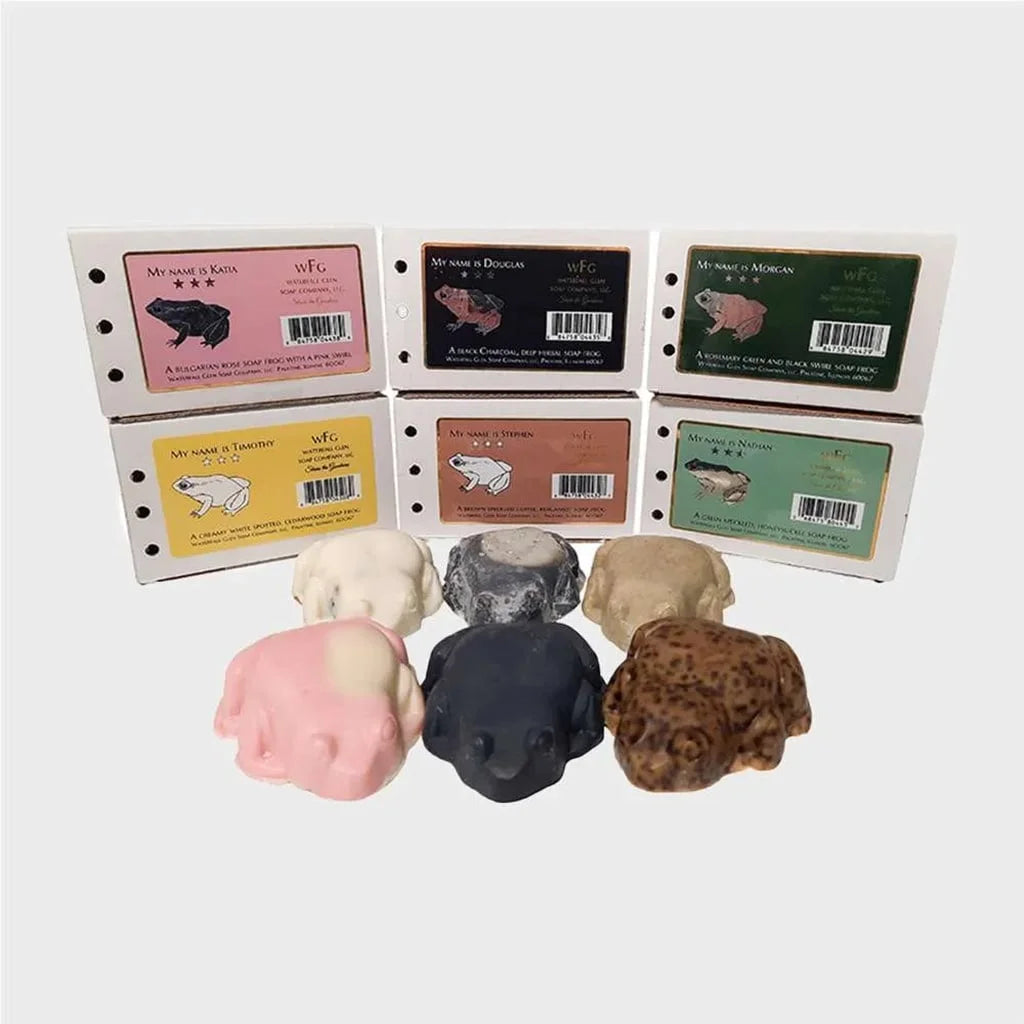 soap frog family, variety of all soap frogs, white, grey, black, brown, pink, and peach colored frog soaps and their boxes