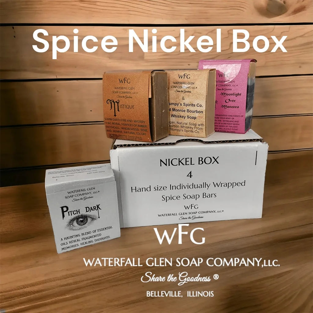 spice scented nickel box of four bar soaps on top of the packaging container on a wooden table