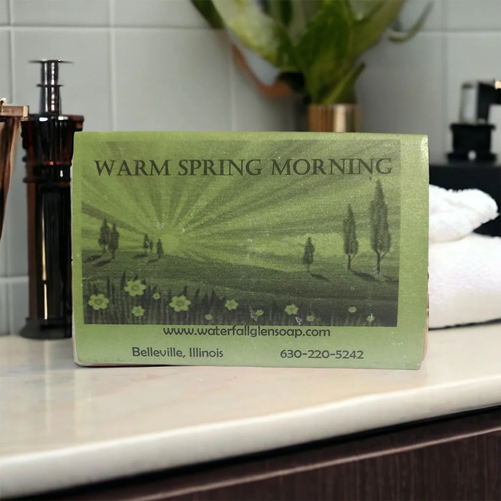 warm spring morning vegan bar soap, green label with a graphic in a rural plains field